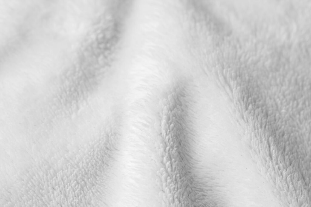 A white wool blanket close up.